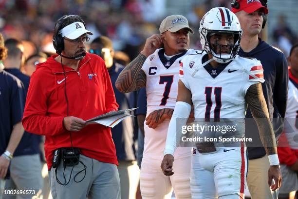 Arizona Wildcats head coach Jedd Fisch and Arizona Wildcats quarterback Noah Fifita on the sidelines during the second half of a football game...