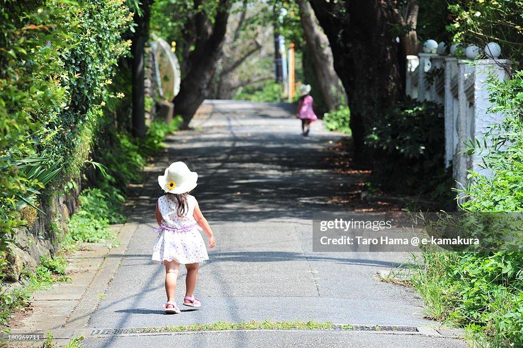 Girls walking on mountain road