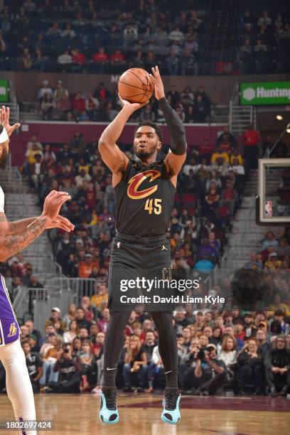 Donovan Mitchell of the Cleveland Cavaliers three point basket against the Los Angeles Lakers on November 25, 2023 at Rocket Mortgage FieldHouse in...