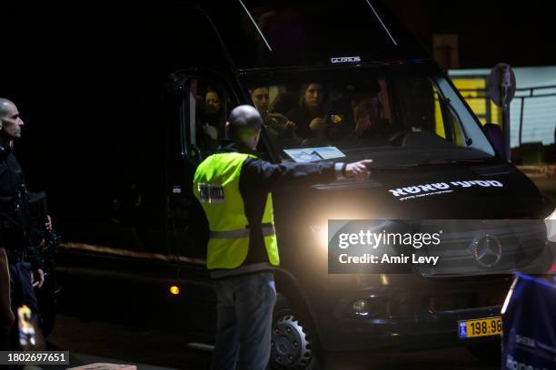 Van carrying hostages released from the Gaza Strip as part of a deal between Israel and Hamas arrives at Sheba Medical Center on November 26, 2023 in...