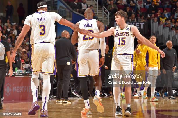 Austin Reaves and Anthony Davis of the Los Angeles Lakers high five during the game against the Cleveland Cavaliers on November 25, 2023 at Rocket...