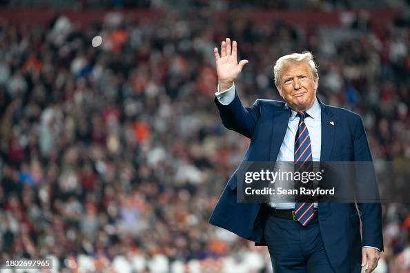 Donald Trump Attends The Palmetto Bowl In South Carolina As He Campaigns For President