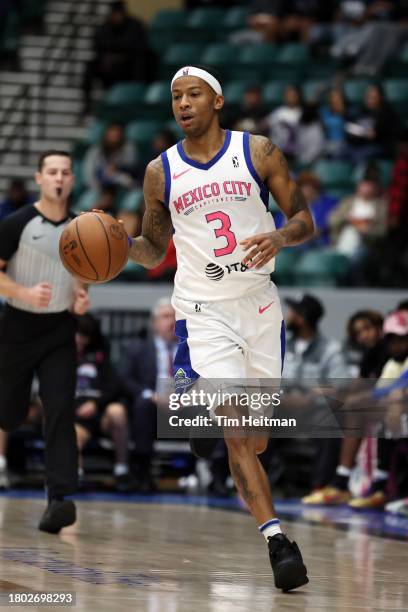 Trey Burke of the Mexico City Capitanes dribbles the ball up court during the game against the Texas Legends in the first half on November 25, 2023...