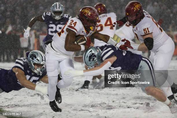 Iowa State Cyclones running back Abu Sama III eludes 2 tacklers during a run in the second quarter of a Big 12 football game between the Iowa State...