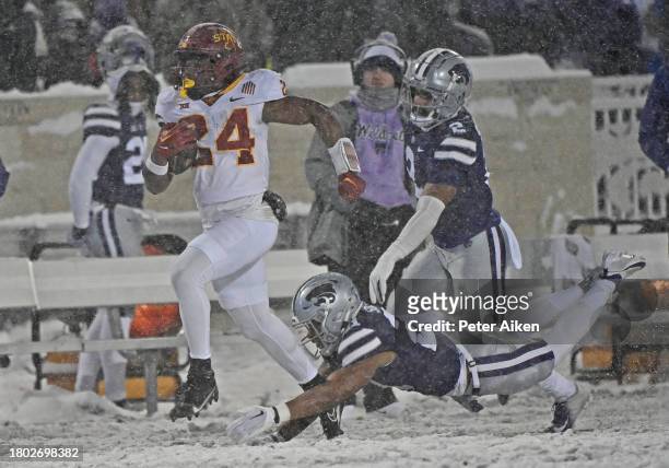 Running back Abu Sama III of the Iowa State Cyclones runs for a touchdown against safety Marques Sigle of the Kansas State Wildcats in the first half...
