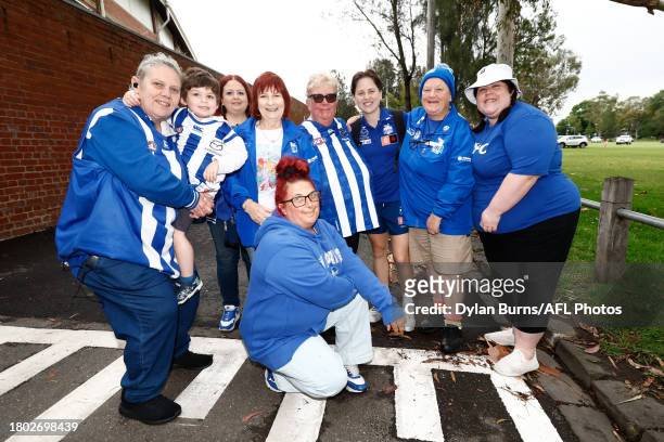 Tess Craven of the Kangaroos poses for a photo with fans before the 2023 AFLW Second Preliminary Final match between The North Melbourne Tasmanian...