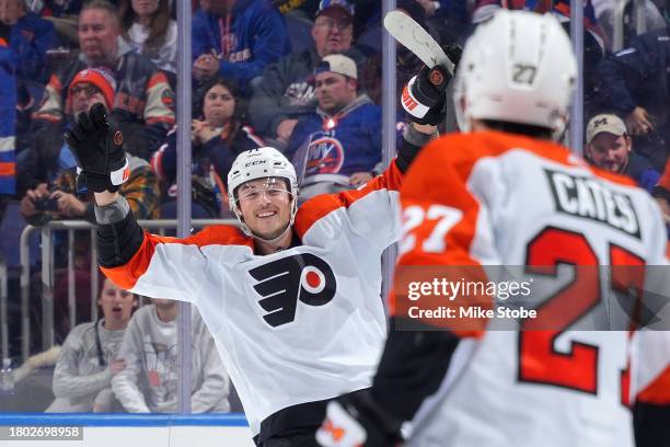 Tyson Foerster of the Philadelphia Flyers celebrates after scoring the game winning shootout goal against the New York Islanders at UBS Arena on...