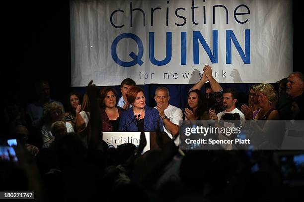 New York City Council Speaker Christine Quinn stands with her wife Kim Catullo while giving her concession speech in the New York Democratic mayoral...