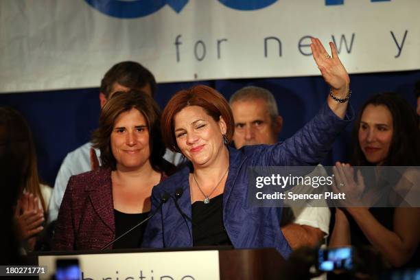 New York City Council Speaker Christine Quinn waves with her wife Kim Catullo while giving her concession speech in the New York Democratic mayoral...