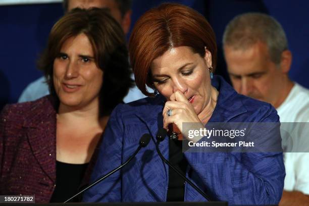 New York City Council Speaker Christine Quinn speaks next to her wife Kim Catullo during her concession speech in the New York Democratic mayoral...