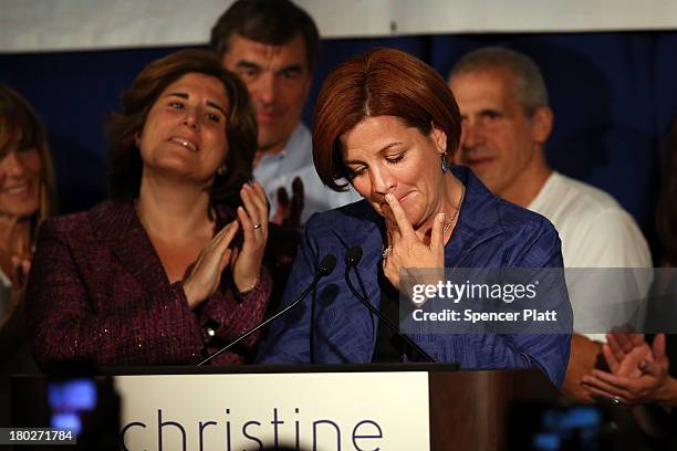 New York City Council Speaker Christine Quinn speaks next to her wife Kim Catullo during her concession speech in the New York Democratic mayoral...