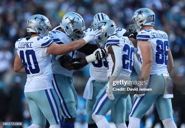 Tony Pollard of the Dallas Cowboys celebrates after a touchdown with teammates during the fourth quarter in the game against the Carolina Panthers at...