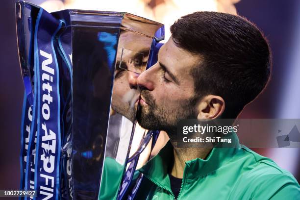 Novak Djokovic of Serbia kisses the Nitto ATP Finals trophy after the Men's Singles Final match against Jannik Sinner of Italy during day eight of...