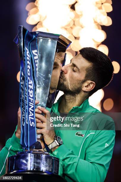 Novak Djokovic of Serbia kisses the Nitto ATP Finals trophy after the Men's Singles Final match against Jannik Sinner of Italy during day eight of...