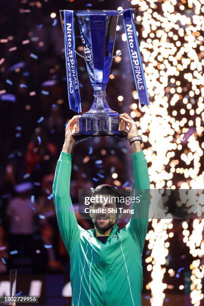 Novak Djokovic of Serbia lifts the Nitto ATP Finals trophy after the Men's Singles Final match against Jannik Sinner of Italy during day eight of the...