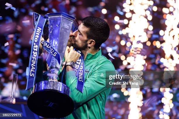 Novak Djokovic of Serbia kisses the Nitto ATP Finals trophy after the Men's Singles Final match against Jannik Sinner of Italy during day eight of...