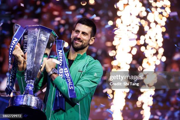 Novak Djokovic of Serbia lifts the Nitto ATP Finals trophy after the Men's Singles Final match against Jannik Sinner of Italy during day eight of the...