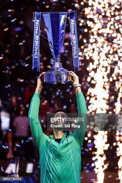 Novak Djokovic of Serbia lifts the Nitto ATP Finals trophy after the Men's Singles Final match against Jannik Sinner of Italy during day eight of the...