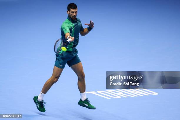 Novak Djokovic of Serbia plays a forehand in the Men's Singles Final match against Jannik Sinner of Italy during day eight of the Nitto ATP Finals at...