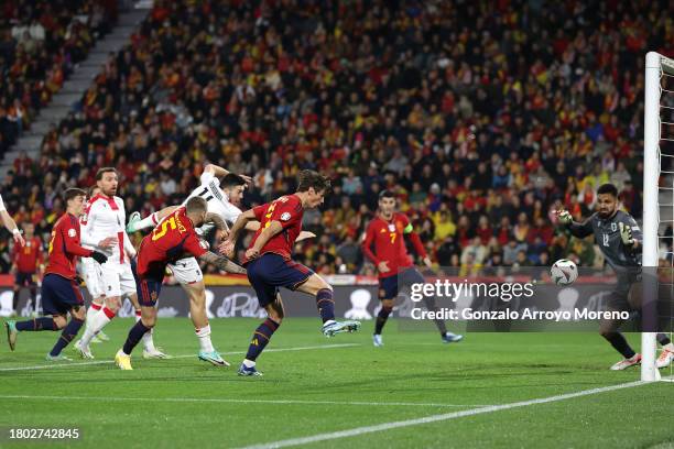Robin Le Normand of Spain scores the team's first goal past Giorgi Mamardashvili of Georgia during the UEFA EURO 2024 European qualifier match...