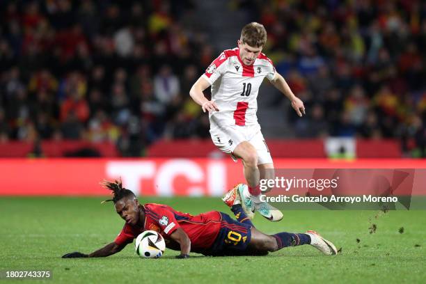 Nico Williams of Spain is challenged by Giorgi Chakvetadze of Georgia during the UEFA EURO 2024 European qualifier match between Spain and Georgia at...