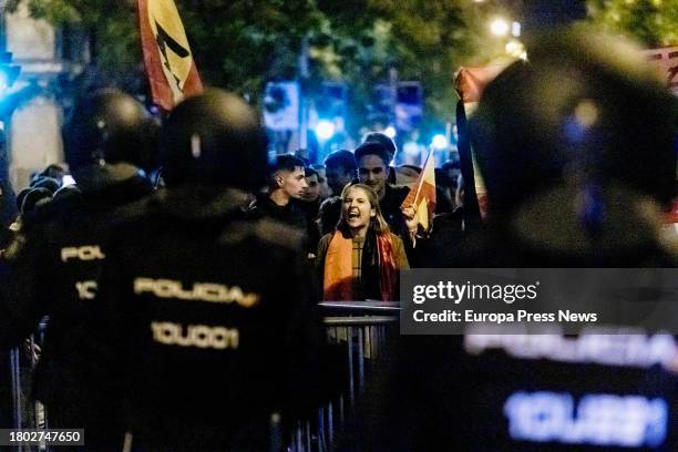 Demonstrator confronts the police during a demonstration against the amnesty in front of the PSOE headquarters in Ferraz, on 19 November, 2023 in...