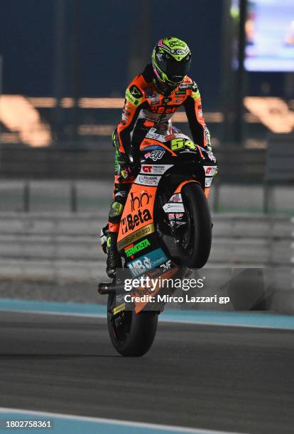 Fermin Aldeguer of Spain and SpeedUp Racing lifts the front wheel and celebrates the victory at the end of the Moto2 race during the MotoGP of Qatar...