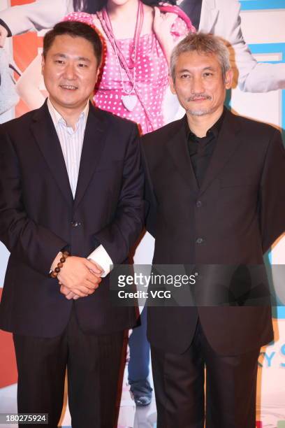 Producer Yu Dong and director Tsui Hark attend "My Lucky Star" premiere at Saga Cinema on September 10, 2013 in Beijing, China.