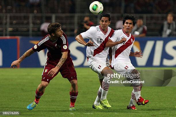 Claudio Miguel Pizarro Bosio of Peru competes for the ball during a match between Venezuela and Peru as part of the 16th round of the South American...