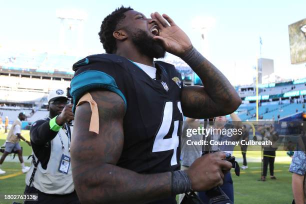 Josh Allen of the Jacksonville Jaguars celebrates after beating the Tennessee Titans 34-14 at EverBank Stadium on November 19, 2023 in Jacksonville,...