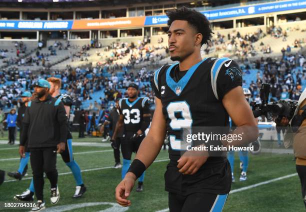 Bryce Young of the Carolina Panthers walks onto the field after a loss to the Dallas Cowboys at Bank of America Stadium on November 19, 2023 in...