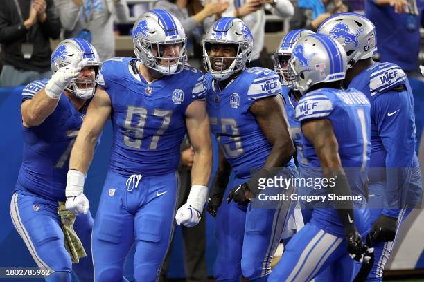 Aidan Hutchinson of the Detroit Lions reacts after a fourth quarter safety during a game against the Chicago Bears at Ford Field on November 19, 2023...