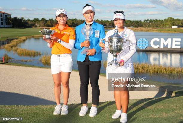 Atthaya Thitikul of Thailand poses with the Vare trophy, Amy Yang of Korea with the CME Globe trophy and Lilia Vu of the United States with the Rolex...