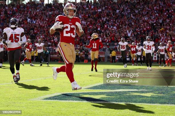 Christian McCaffrey of the San Francisco 49ers scores a touchdown during the first quarter of a game against the Tampa Bay Buccaneers at Levi's...