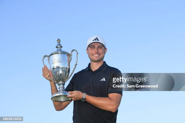 Ludvig Aberg of Sweden poses for a photo with the trophy after winning The RSM Classic on the Seaside Course at Sea Island Resort on November 19,...