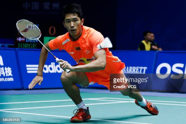 Tian Houwei of China competes in the men's singles match against Jan O Jorgensen of Denmark on day 2 of the 2013 China Badminton Masters at Changzhou...