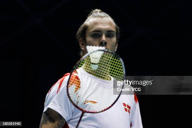 Jan O Jorgensen of Denmark competes in the men's singles match against Tian Houwei of China on day 2 of the 2013 China Badminton Masters at Changzhou...