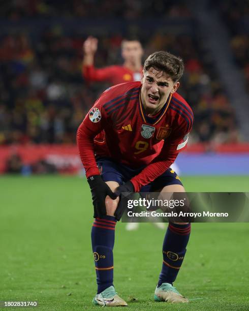 Pablo Paez Gavira alias Gavi of Spain grimaces in pain as he holds his knee during the UEFA EURO 2024 European qualifier match between Spain and...