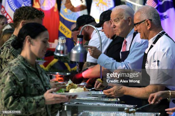 President Joe Biden serves service members and military families from the USS Dwight D. Eisenhower and the USS Gerald R. Ford during a Friendsgiving...