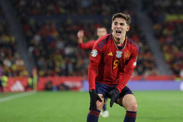 Pablo Paez Gavira alias Gavi of Spain grimaces in pain as he holds his knee during the UEFA EURO 2024 European qualifier match between Spain and...