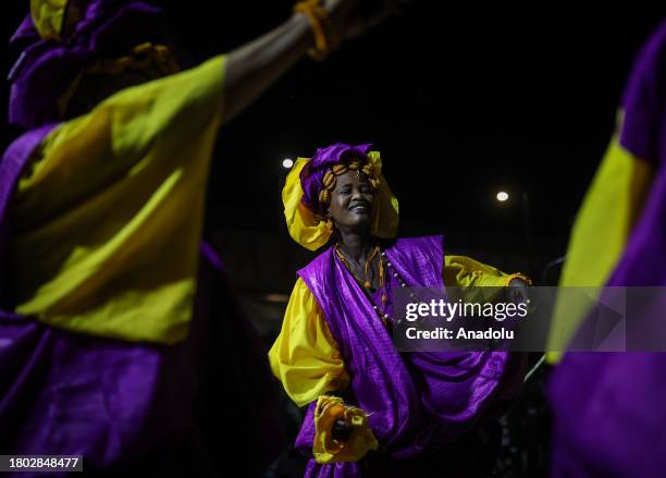 Senegalese people wearing traditional face paints and clothes, perform dances belonging to ethnic group ''Lebu'' settled in Yoff village, as mayor of...