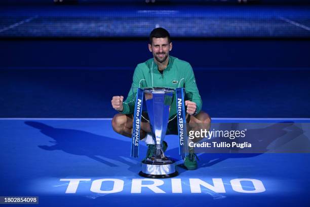 Novak Djokovic of Serbia poses with the Nitto ATP Finals trophy after victory against Jannik Sinner of Italy in the Men's Singles Finals between...