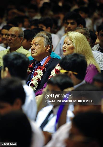 Indian born music conductor and composer, Zubin Mehta , and his wife Nancy Kovack sit with students after arriving at St. Mary's school, his alma...