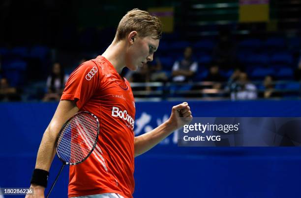 Viktor Axelsen of Denmark competes in the men's singles match against Wang Zhengming of China on day 2 of the 2013 China Badminton Masters at...