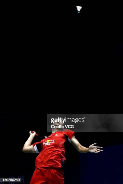 Wang Zhengming of China competes in the men's singles match against Viktor Axelsen of Denmark on day 2 of the 2013 China Badminton Masters at...