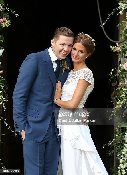 Professor Green and Millie Mackintosh pose on their wedding day at Babington House on September 10, 2013 in Frome, England.