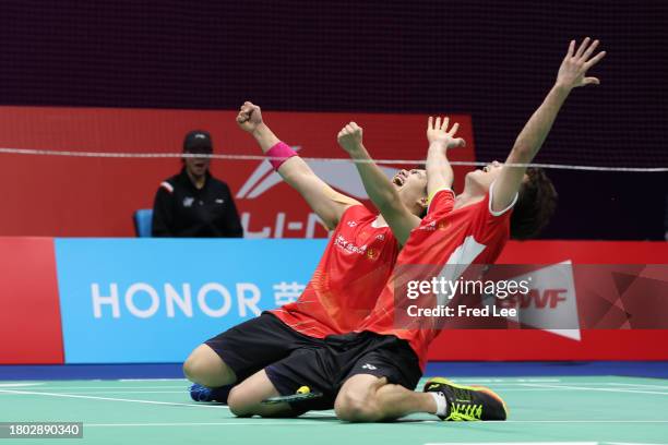 Wang Chang and Liang Weikeng of China celebrate the victory with teammate in the Men's Doubles Final match against Satwiksairaj Rankireddy and Chirag...