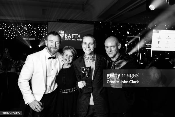 Tony Curran, guest, Lewis Gribben and guest attend the 2023 BAFTA Scotland Awards After Party held at the DoubleTree by Hilton Glasgow Central on...