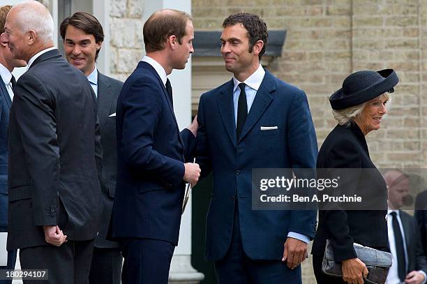 Prince William, Duke of Cambridge and Hugh van Cutsem Jr attend a requiem mass for Hugh van Cutsem who passed away on September 2nd 2013 at Brentwood...