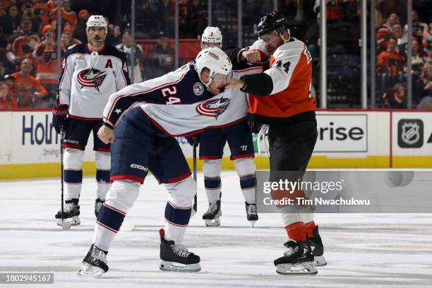 Nicolas Deslauriers of the Philadelphia Flyers and Mathieu Olivier of the Columbus Blue Jackets fight during the first period at the Wells Fargo...